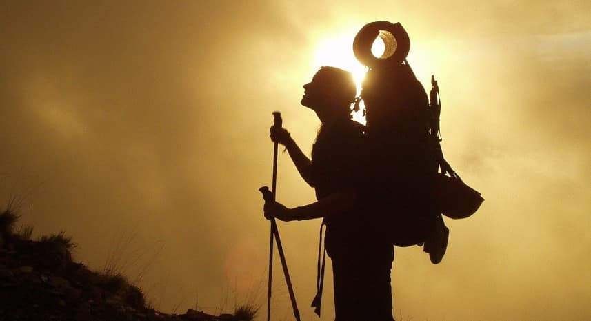 Hiker looking up mountain